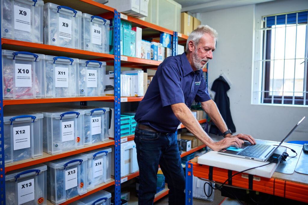 Adam Reigate working in back office