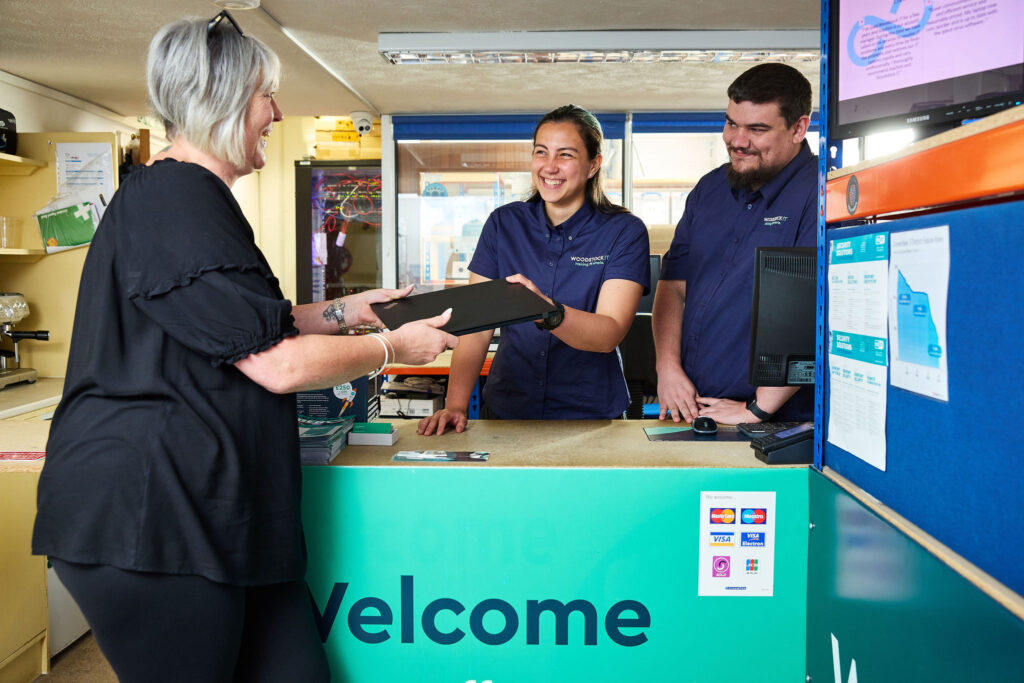 Jake and Catherine helping a customer 2